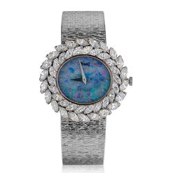 LADIES PIAGET 18KT WHITE GOLD DIAMOND DRESS WATCH WITH OPAL DIAL.