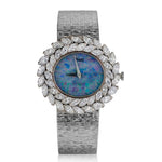 LADIES PIAGET 18KT WHITE GOLD DIAMOND DRESS WATCH WITH OPAL DIAL.