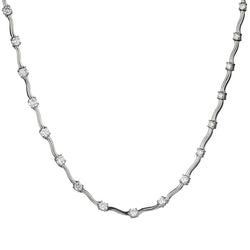 Diamond "tennis necklace" with intermittent diamonds weighing 3.28tw.