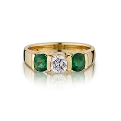 Ladies 18kt Yellow Gold 3 Stone Diamond and Emerald Ring.