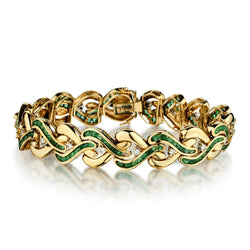 Ladies 18kt Yellow Gold Green Emerald and Diamond Swirl Bracelet.