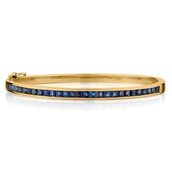 Ladies 18kt Yellow Gold Blue Sapphire Bangle. 3.00 Tw Square Cuts..