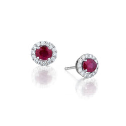 Ladies 18kt white gold Ruby and Diamond stud earings .