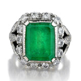 Mid-Century 15.00 Carat Green Emerald And Diamond Halo-Set Ring
