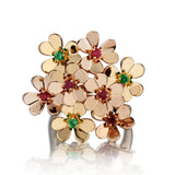 Van Cleef & Arpels "Frivole" Ring . 8 Flowers Set with Rubies and Green Emeralds.