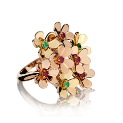 Van Cleef & Arpels "Frivole" Ring . 8 Flowers Set with Rubies and Green Emeralds.