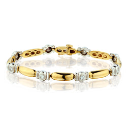 Platinum and 18kt Yellow Gold Diamond Bracelet. 8 x 1.00ct Tw
