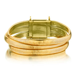Ladies 14kt Yellow Gold Mid Century Triple Tubogas. Bracelet made by Forstner.