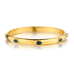 22kt Yellow Gold Hammered Bangle set with Blue Sapphires
