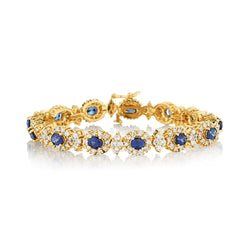 Ladies 14kt Yellow Gold Blue Sapphire and Diamond Cluster Bracelet.