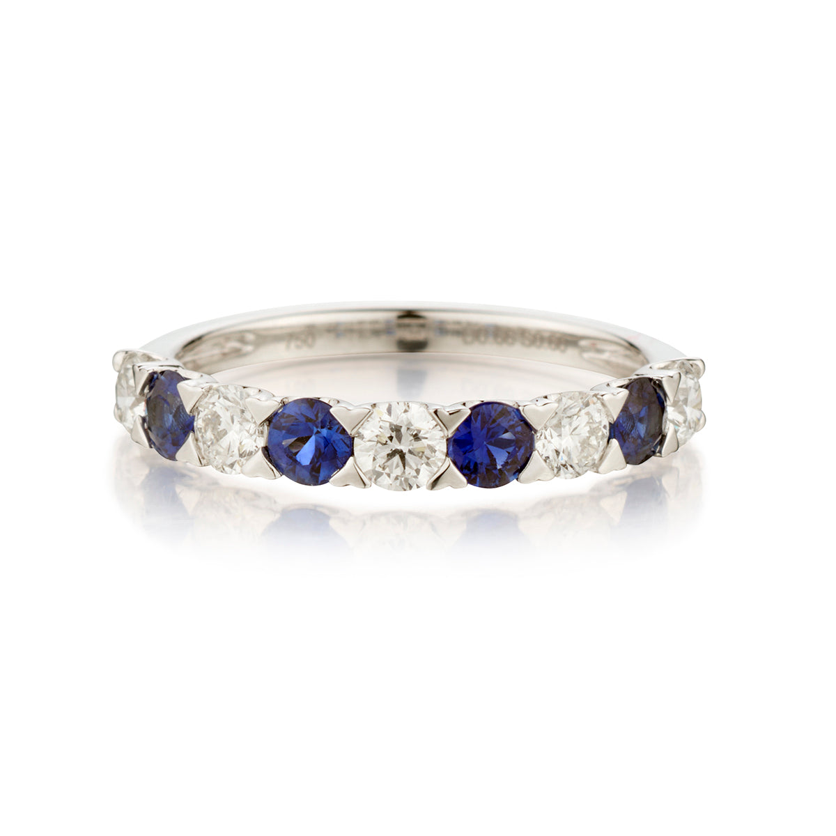 Ladies 18kt White Gold Blue Sapphire and Diamond Band.