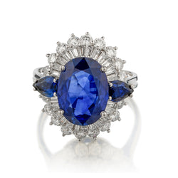 Platinum Blue Sapphire and Diamond Cluster Ring. 5.50 Oval Cut