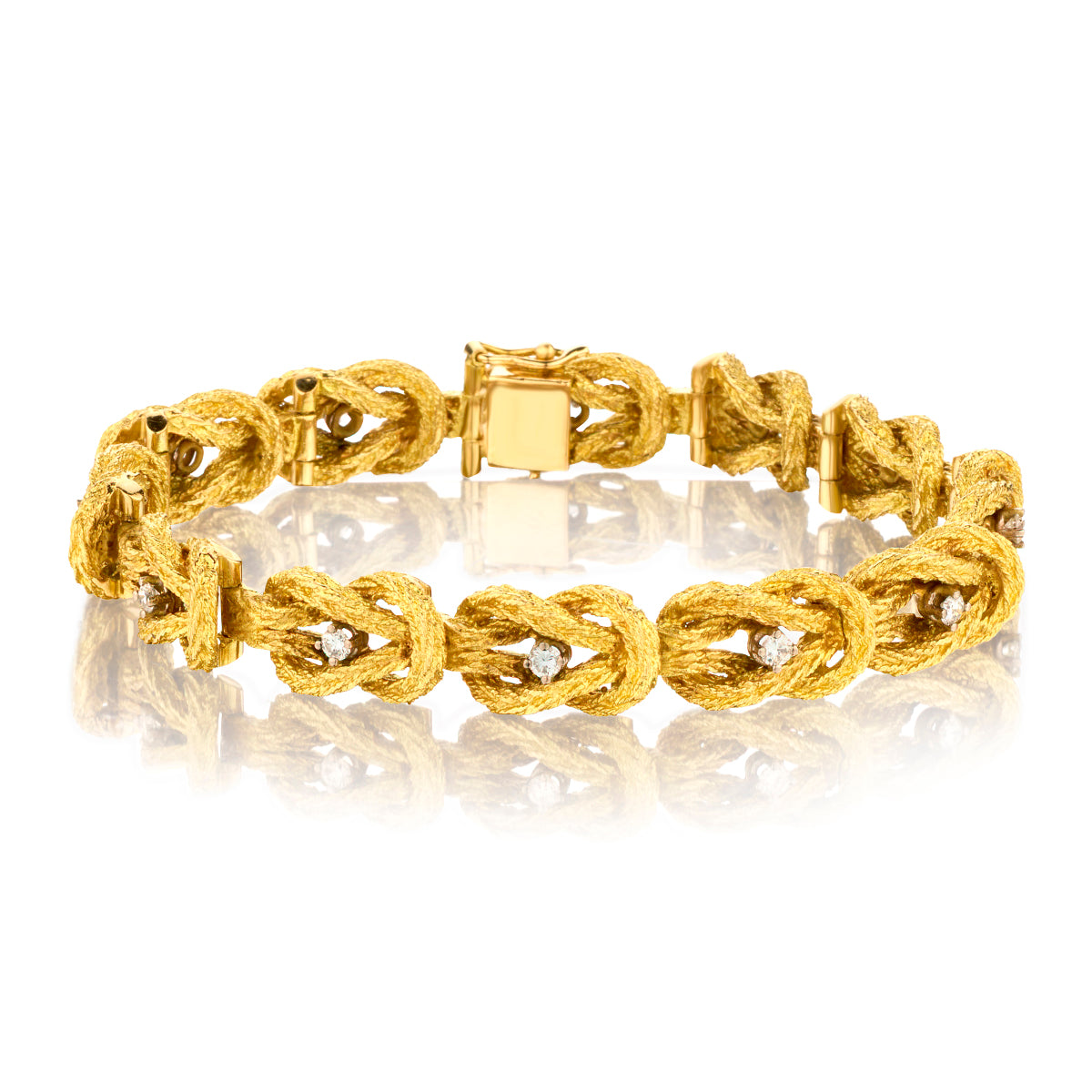 18kt Yellow Gold Braided Diamond Bracelet. 0.60ct Tw. Grams: 56