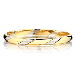 18kt Yellow and White Gold Bangle. Weight: 20.29 grams.