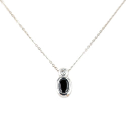 18KT WHITE GOLD SAPPHIRE PENDANT AND CHAIN.