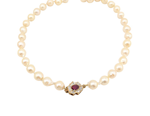 Ladies Baroque Pearl Strand. 7-1/2-8mm. 14kt  Ruby and Diamond Clasp.