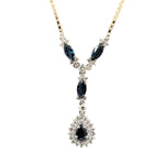14kt Two Tone Gold Pendant set with Blue Sapphires and Diamonds.